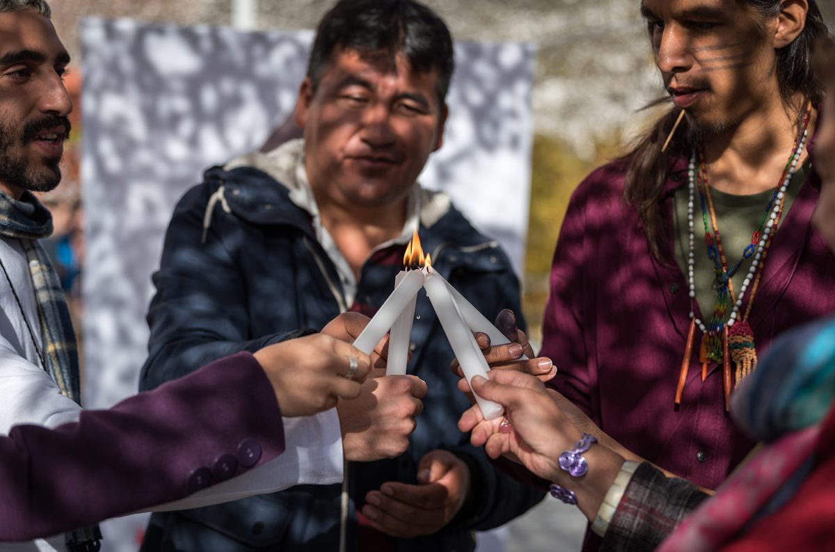 7 December 2019, Madrid, Spain: A group light candles together, as people of faith gather in a 'Prayer for the Rainforest' as part of the Cumbre Social por el Clima, on the fringes of COP25 in Madrid, where faith-based organizations continue to urge decision-makers to take action for climate justice.